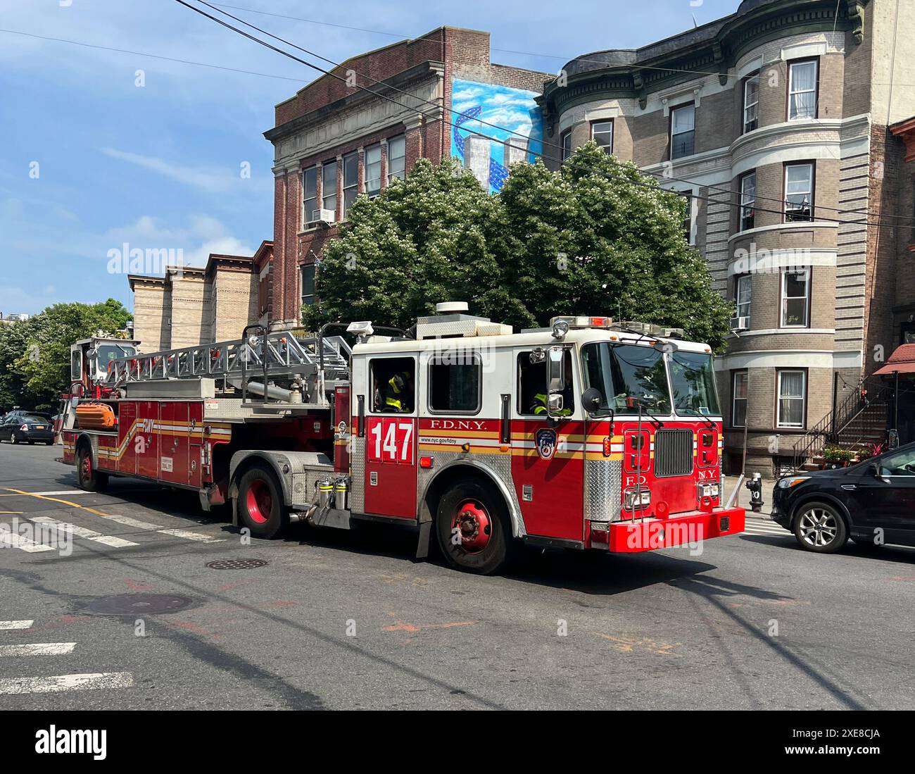 Fire Engine leaves the station on a call along Courtelyou Road in ther Ditmas Park neighborhood of Brooklyn, New York. Stock Photo