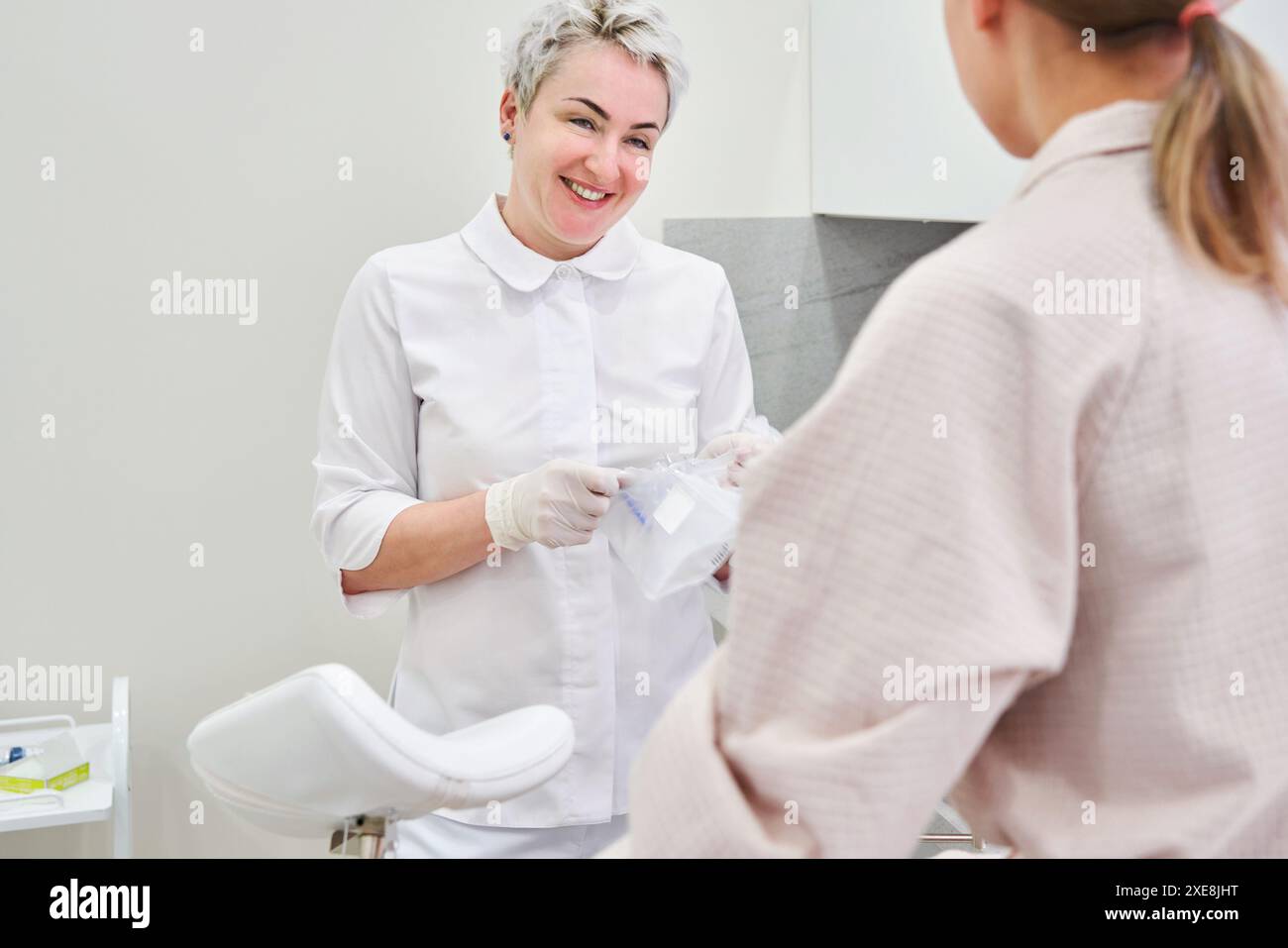 Gynecology consultation. Pregnant woman with her doctor in clinic Stock Photo