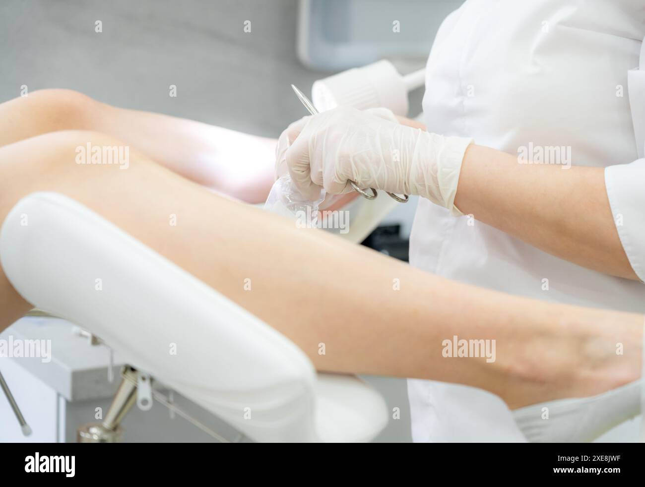 Gynecologist doctor hands holding forceps Stock Photo - Alamy