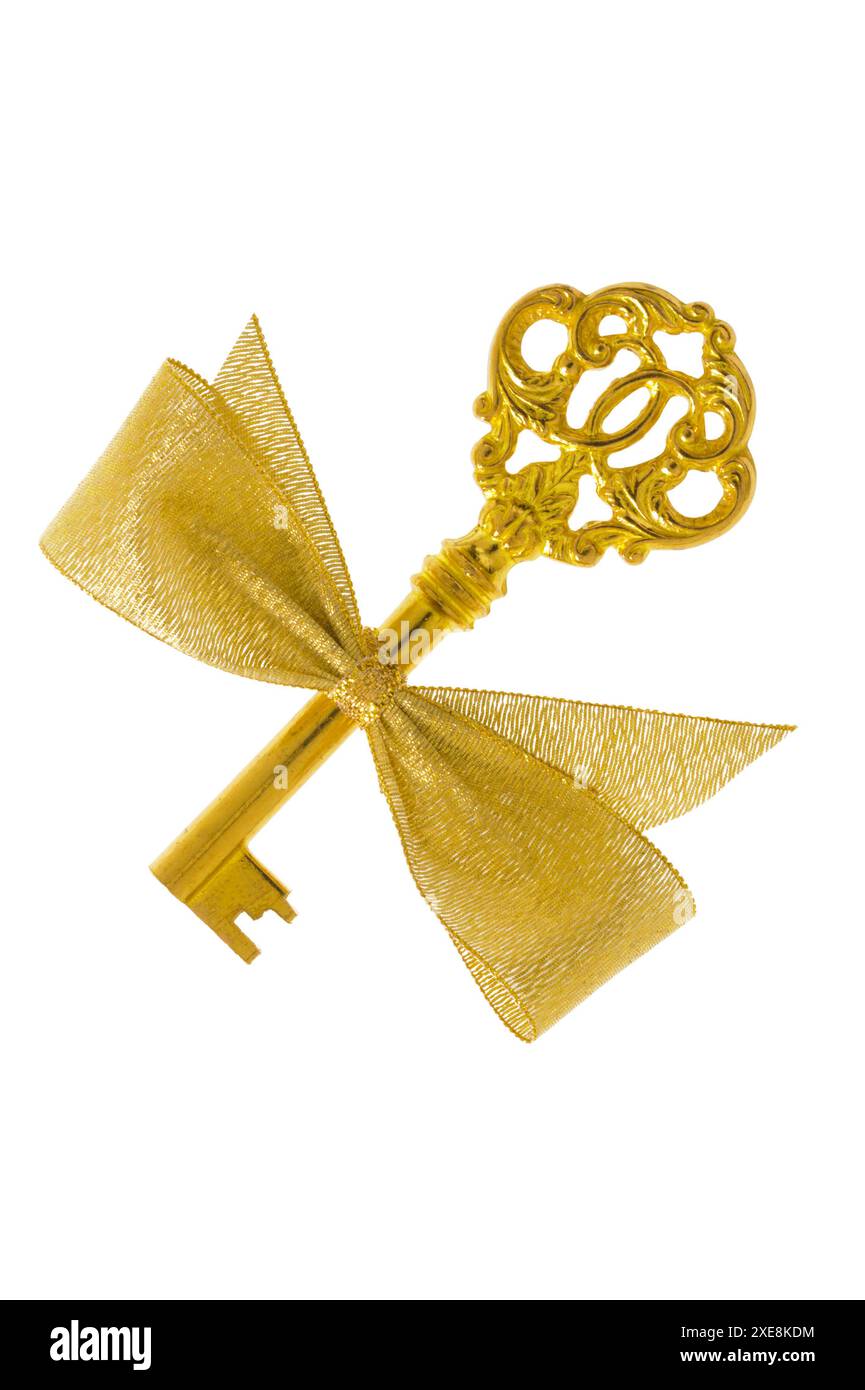 Goldener Schlüssel Goldener Schlüssel mit Schleife isoliert über weißem Hintergrund *** Golden key Golden key with bow isolated over white background Stock Photo