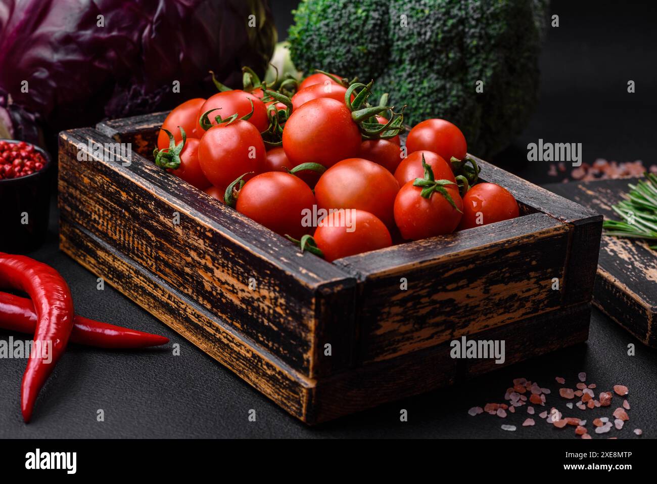 Fresh red cherry tomatoes in a wooden vintage box Stock Photo - Alamy