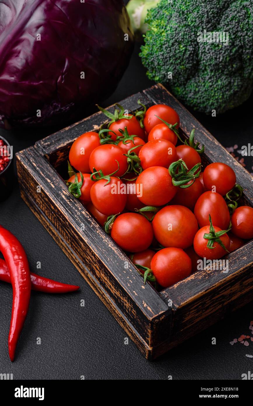 Fresh red cherry tomatoes in a wooden vintage box Stock Photo - Alamy