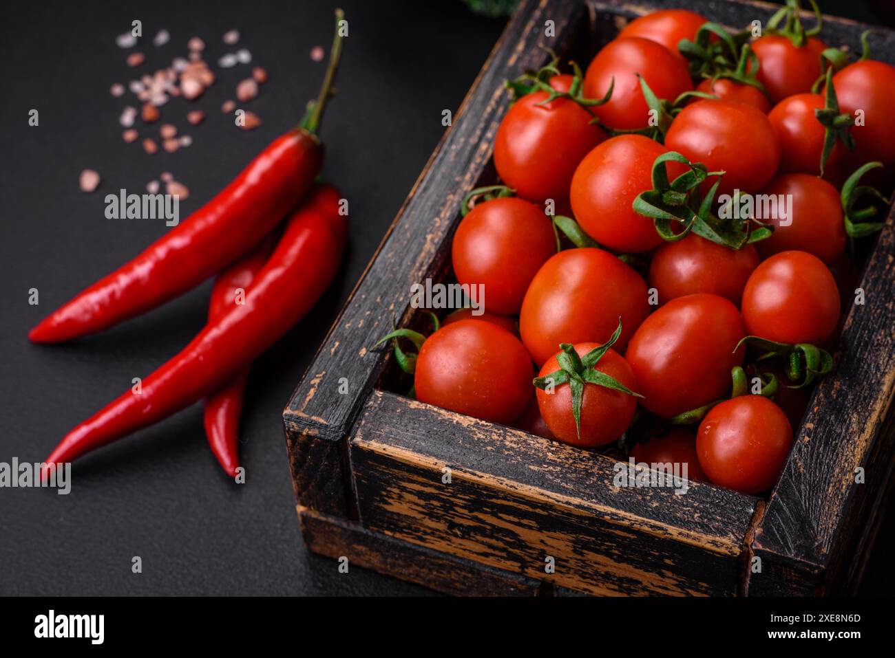 Fresh red cherry tomatoes in a wooden vintage box Stock Photo - Alamy