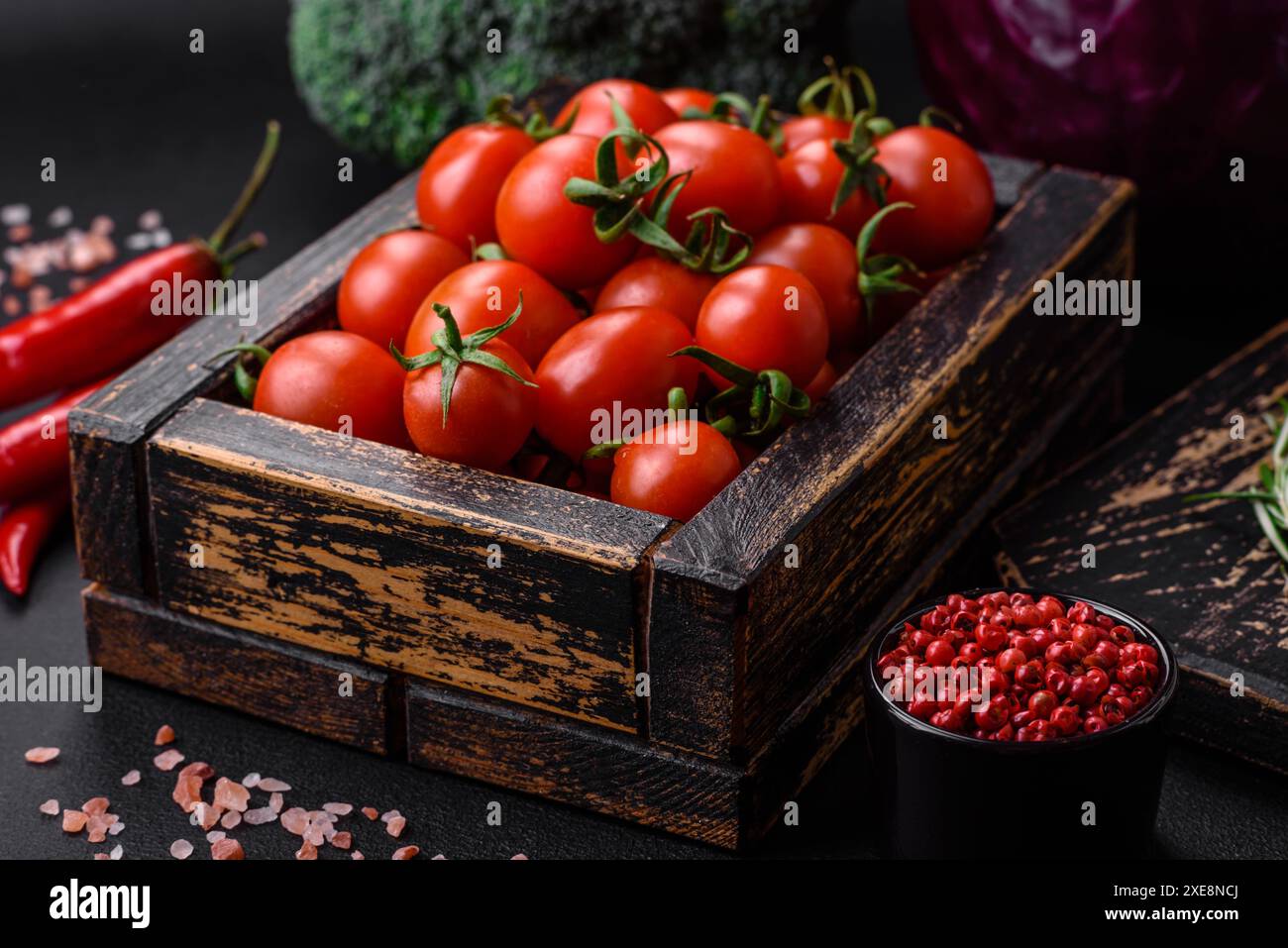 Fresh red cherry tomatoes in a wooden vintage box Stock Photo - Alamy