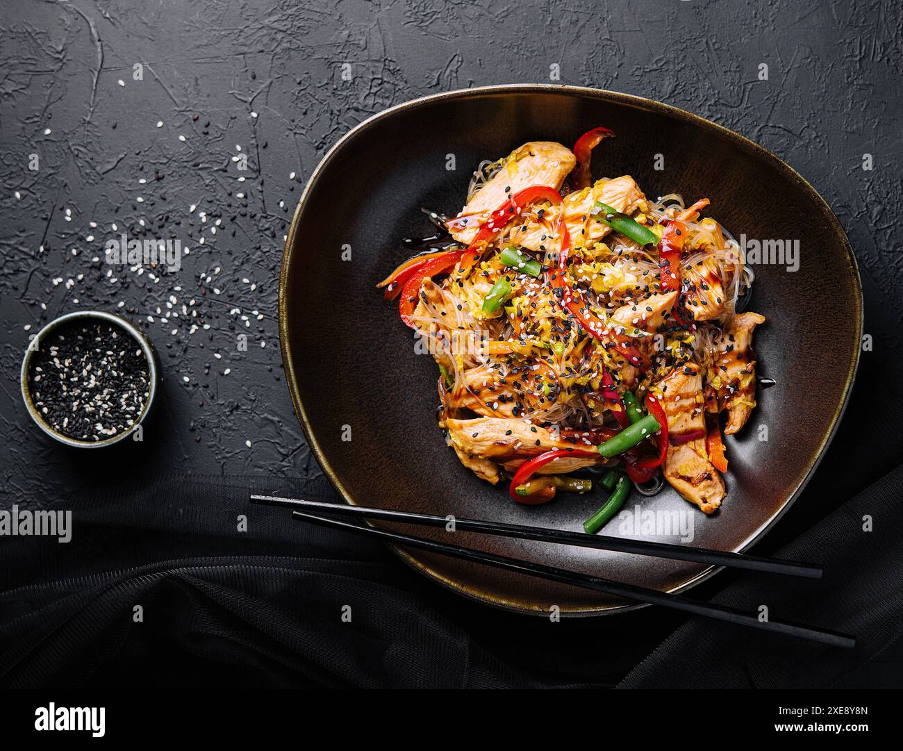 Asian udon noodles with chicken vegetables and teriyaki sauce Stock Photo