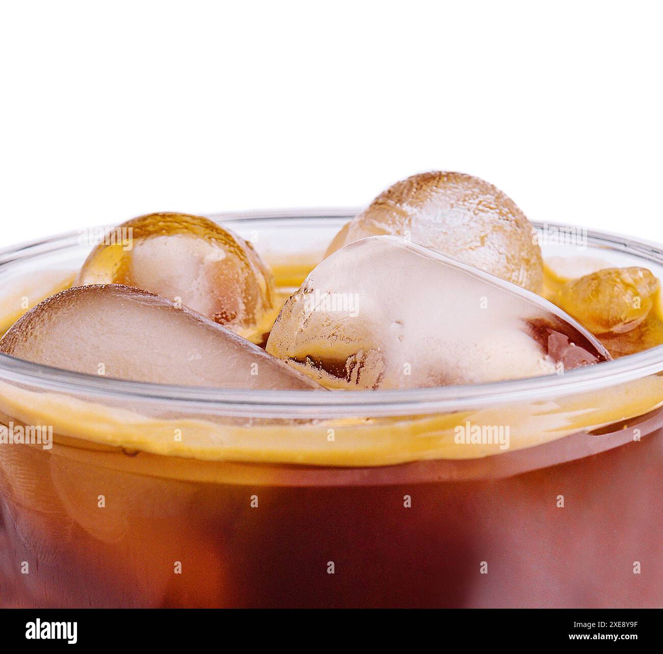 Cola with ice in plastic glass on white background Stock Photo - Alamy