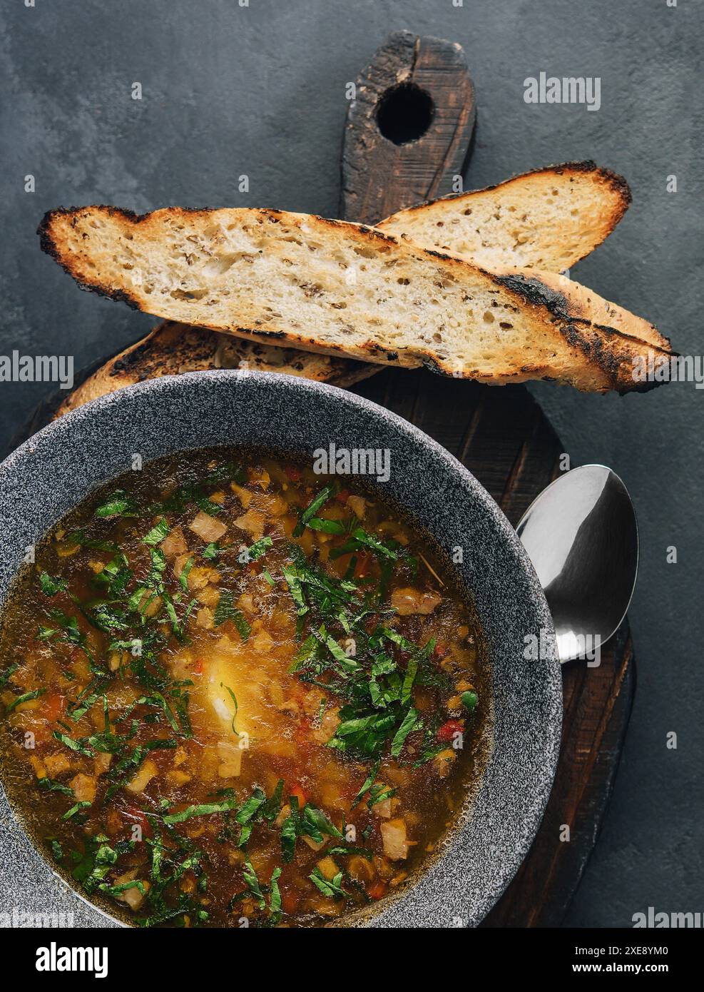 Onion soup with roasted bread top view Stock Photo