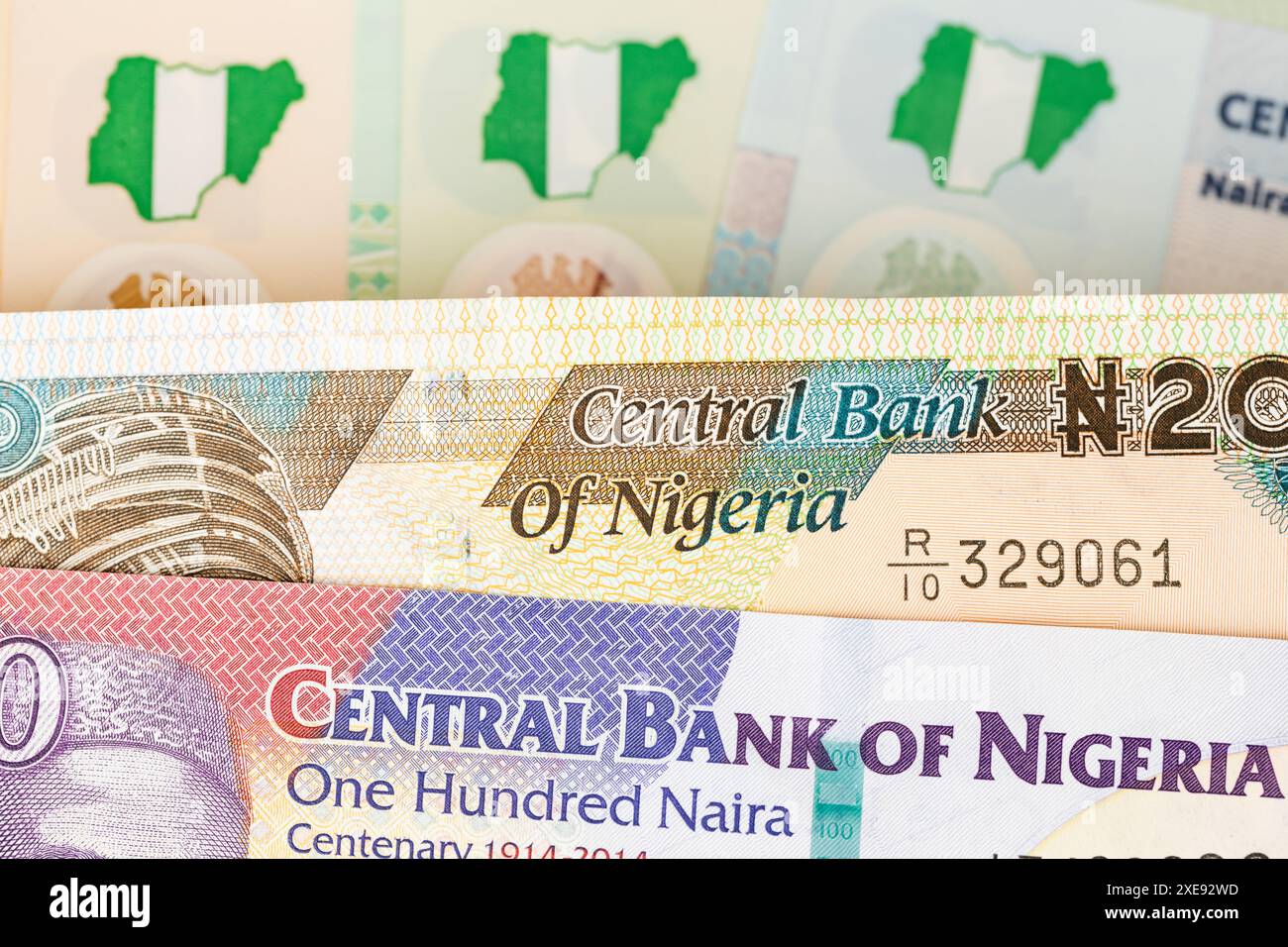 The symbol of the Nigerian money Naira. Nigerian banknotes Stock Photo ...