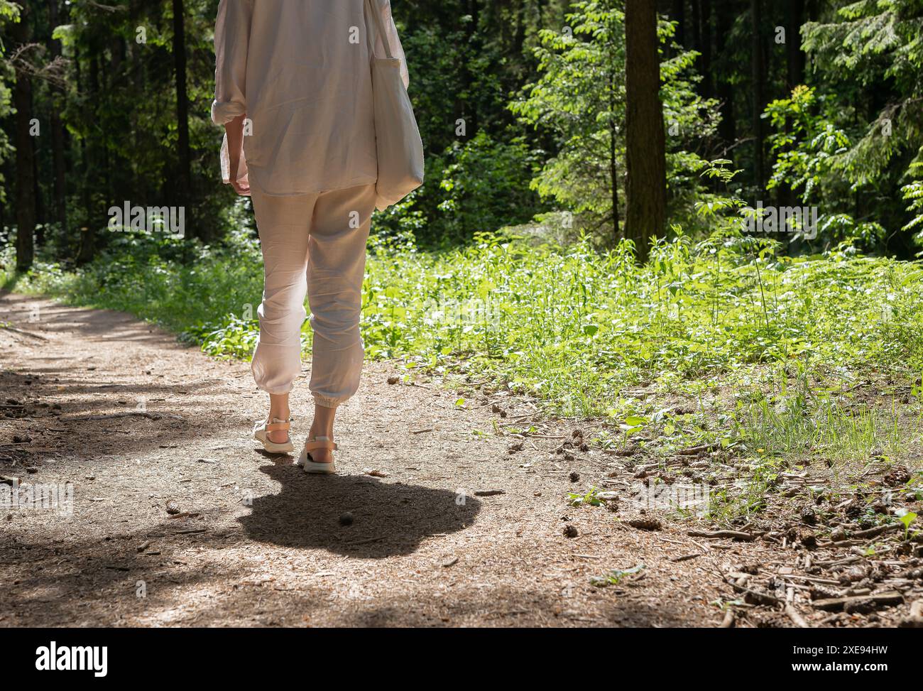 Female walking barefoot in grass hi-res stock photography and images ...