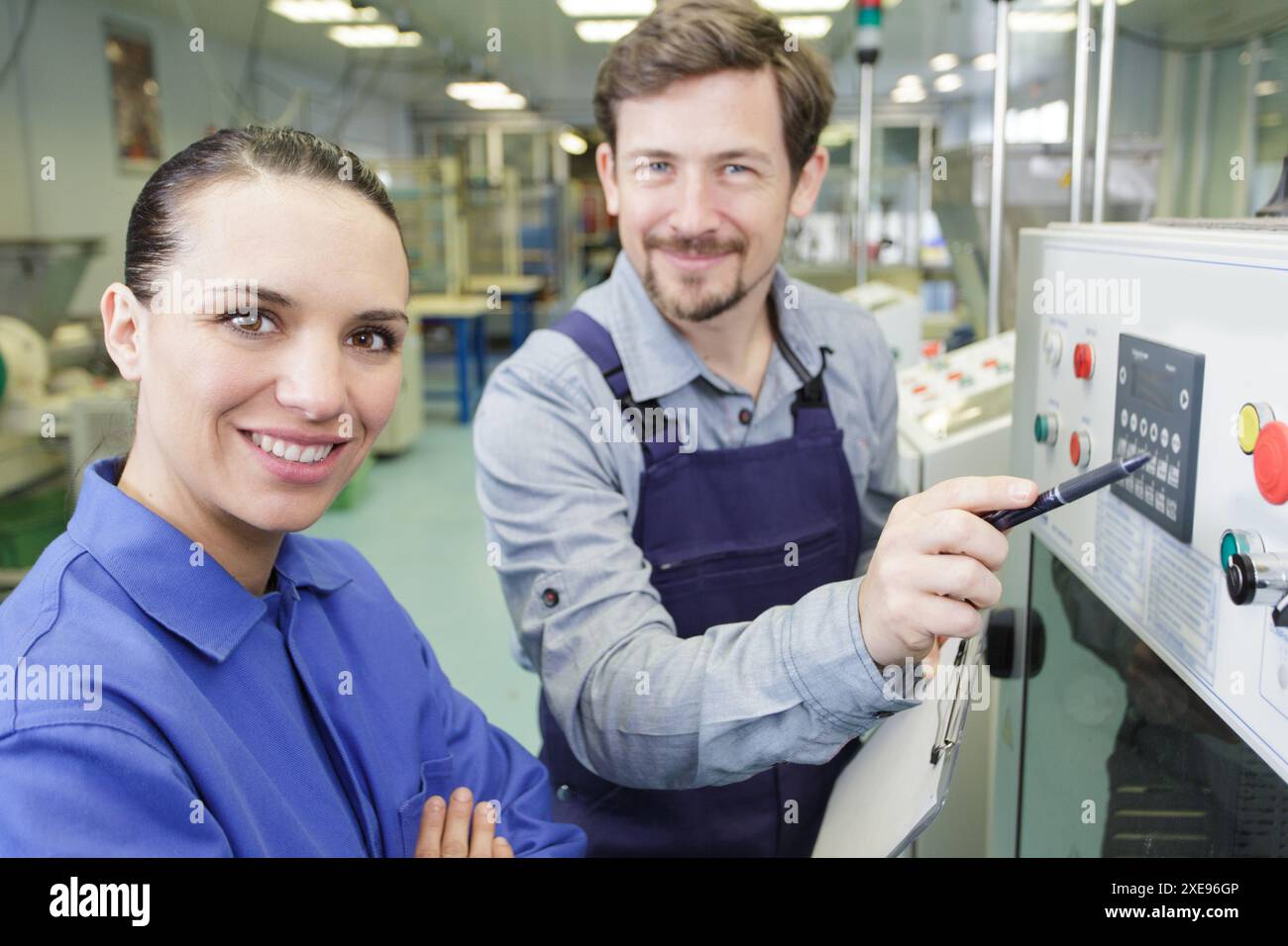 engineer and apprentice in factory Stock Photo - Alamy