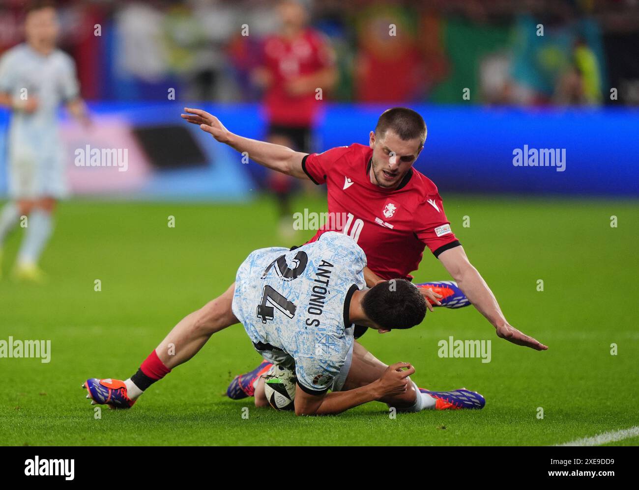 Georgia’s Giorgi Chakvetadze is fouled by Portugal's Antonio Silva during the UEFA Euro 2024 Group F match at the Arena AufSchalke in Gelsenkirchen, Germany. Picture date: Wednesday June 26, 2024. Stock Photo