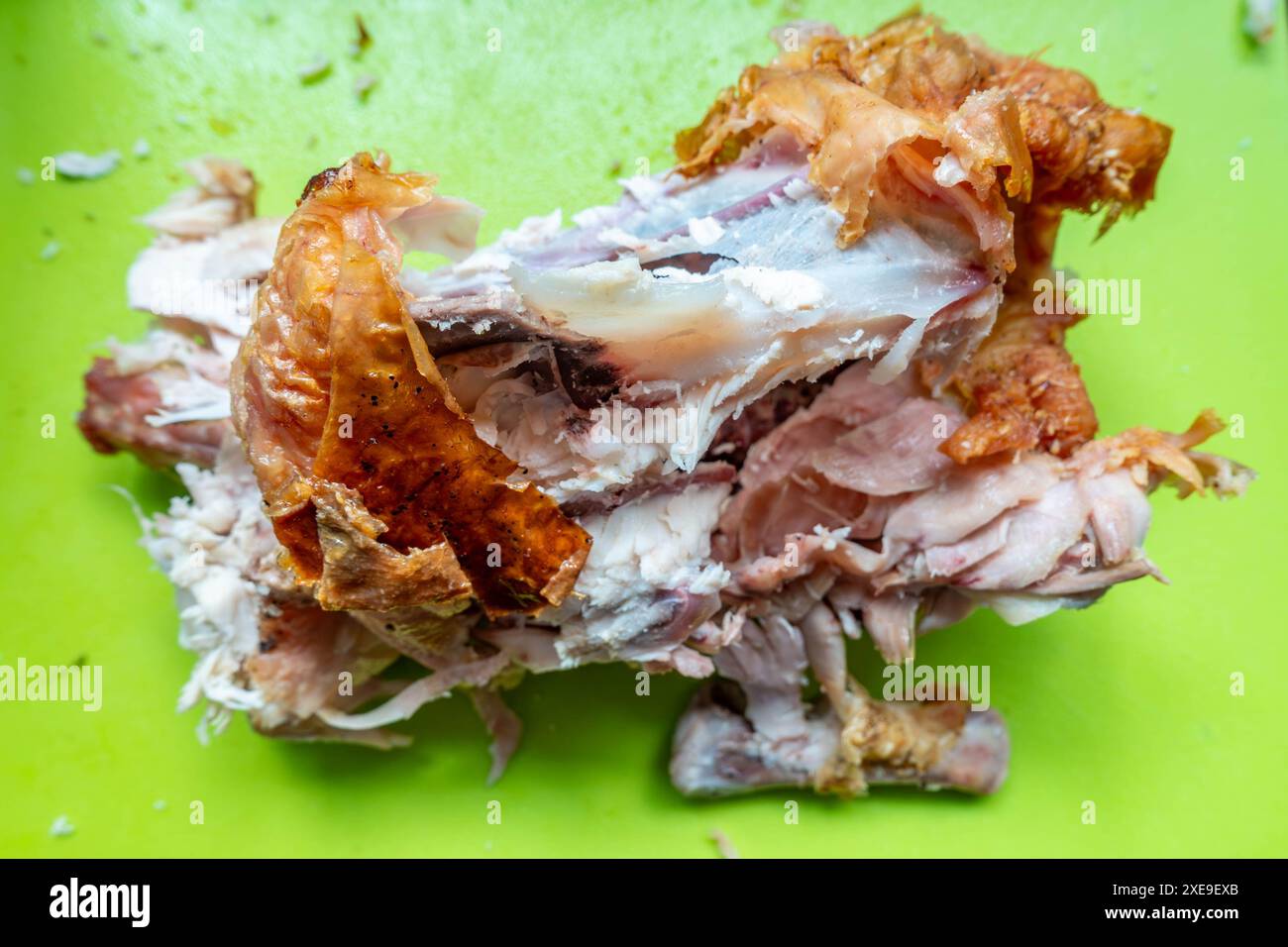 Leftover carcass from a roast chicken, stripped of meat leaving just