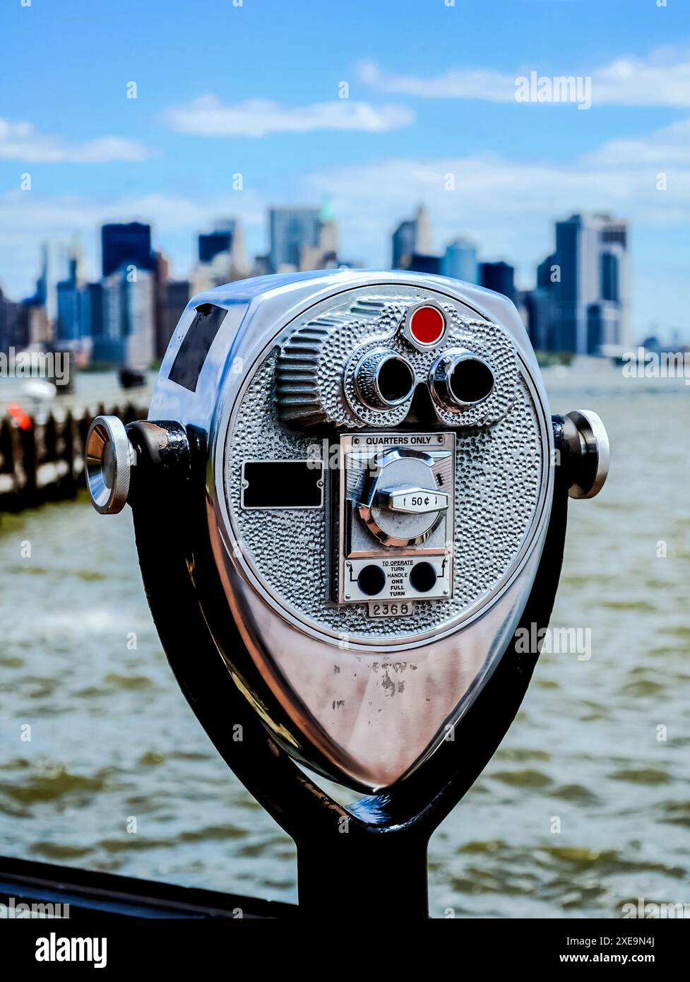 Inspection binoculars on top of a skyscraper to observe the city. Stock Photo