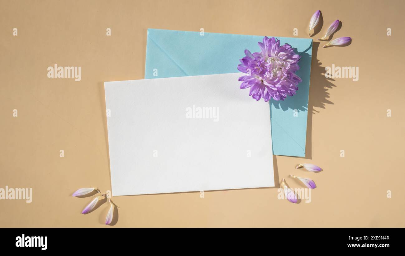Composition with empty paper note and envelope beautiful spring blue ...