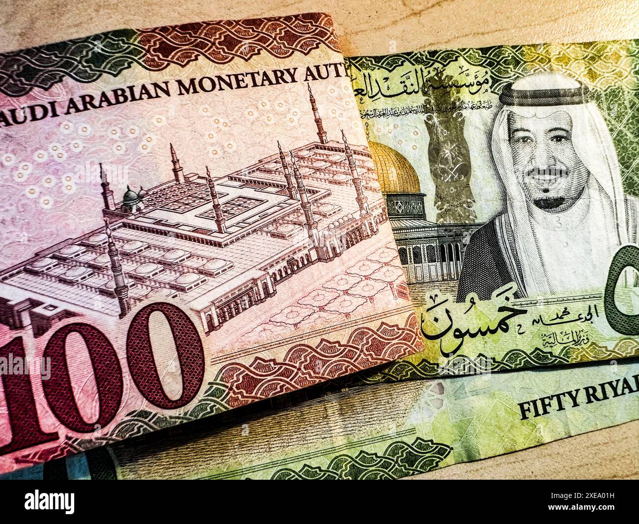 July 25, 2024, Riyadh, Saudi Arabia: A United States Dollar ($USD) and a  Saudi Riyal (SAR)..In a significant geopolitical shift, Saudi Arabia has  abandoned the petrodollar agreement, allowing oil trades in currencies