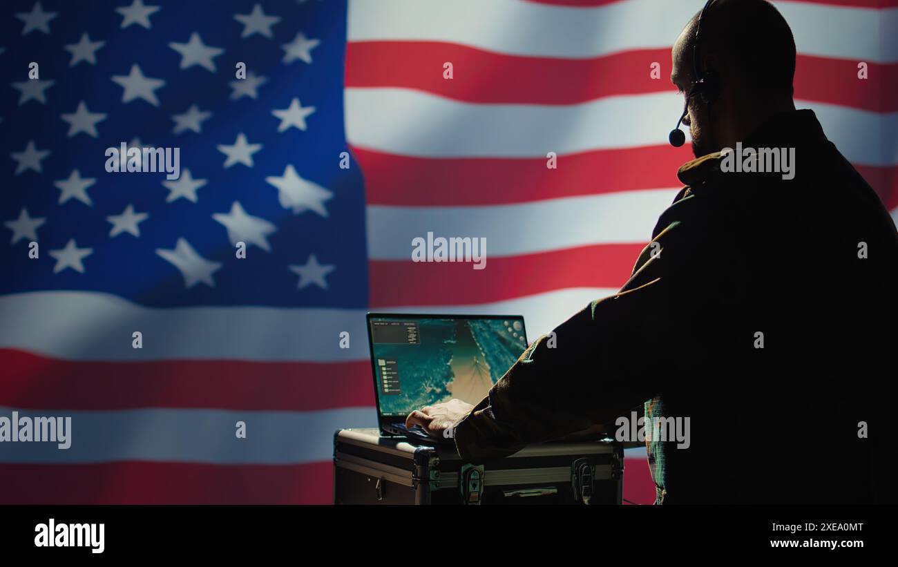 US Air Force agent using radar system on laptop to detect incoming ...