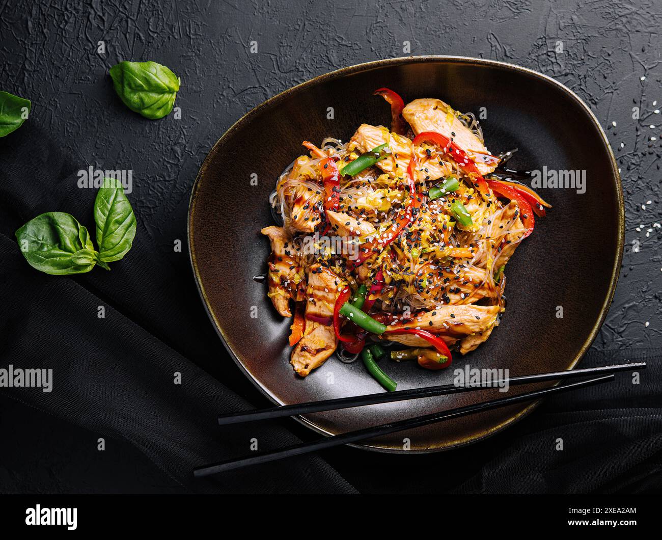 Asian udon noodles with chicken vegetables and teriyaki sauce Stock Photo