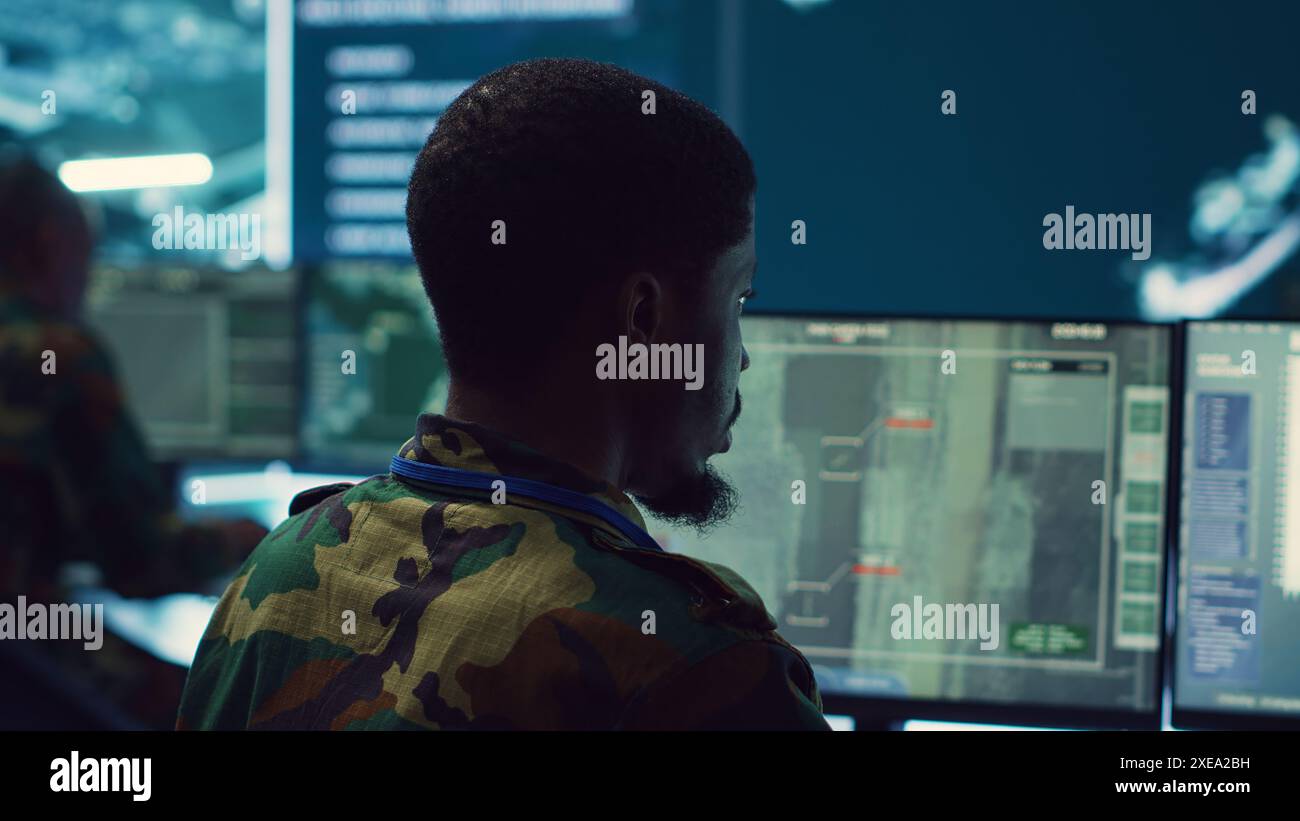 Armed forces officer monitoring satellite hi-res stock photography and ...