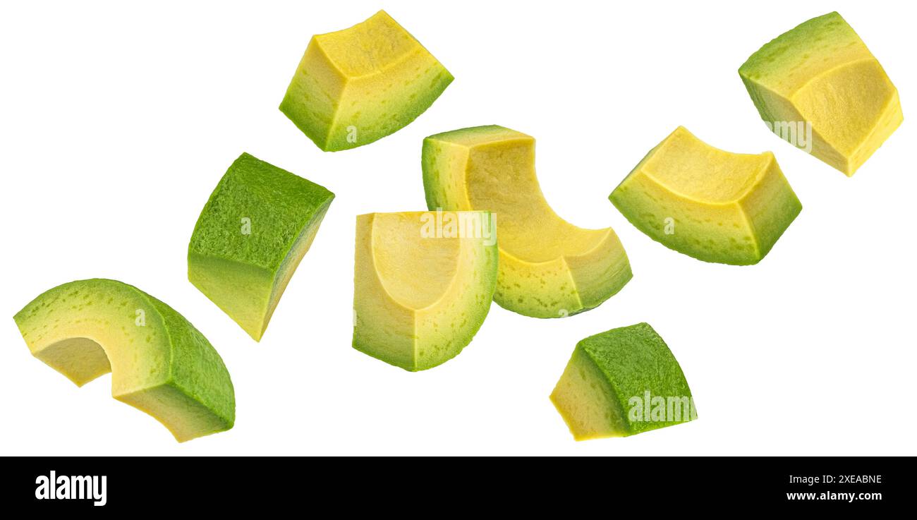 Falling avocado slices isolated on white background Stock Photo