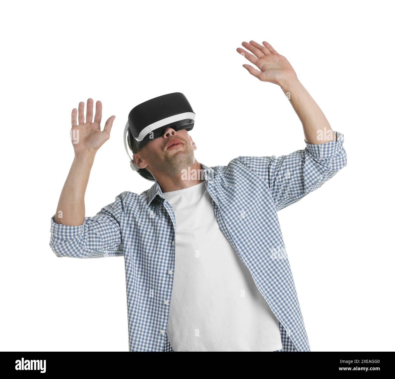 Smiling woman using virtual reality headset on pink background, space for text Stock Photo