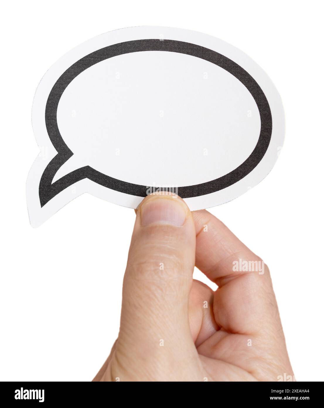 Hand holding a blank speech bubble isolated on white background. Template Mockup Stock Photo
