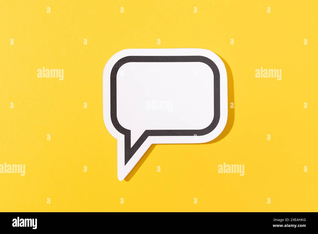 Blank Speech Bubble isolated on yellow background. Mock up template Stock Photo