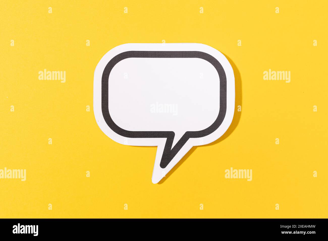 Blank Speech Bubble isolated on yellow background. Mock up template Stock Photo