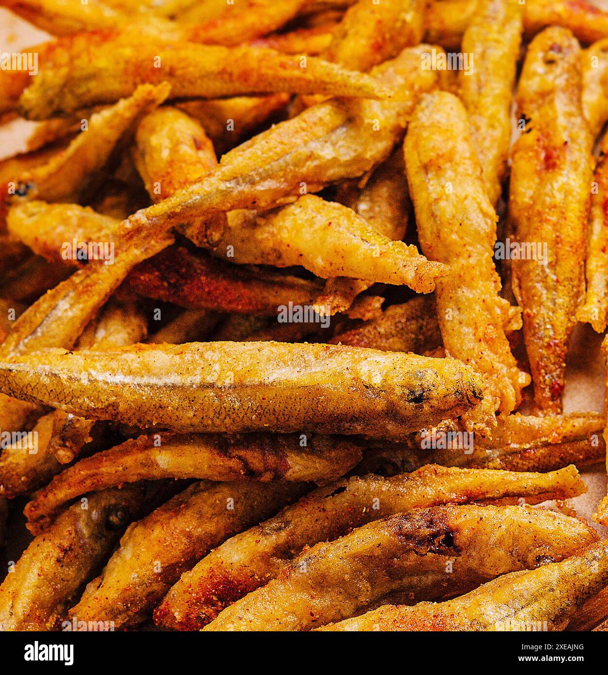 Dried small salted fish heap close up Stock Photo