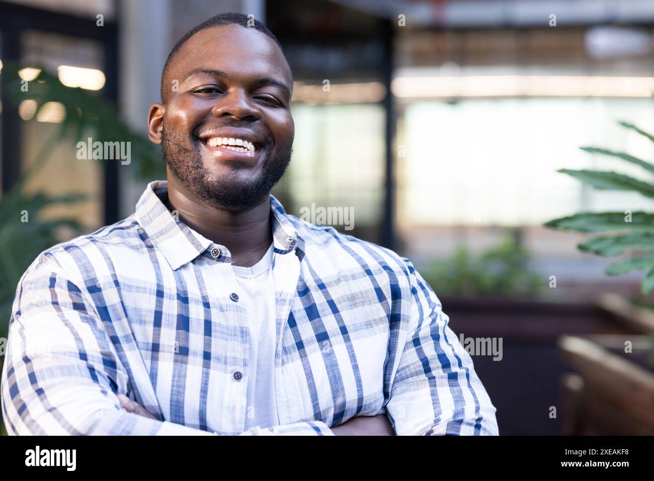 African american man standing arms hi-res stock photography and images ...