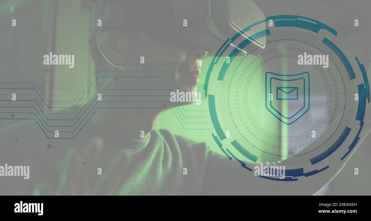 Image of envelope in shield and loading circles, biracial man using vr headset Stock Photo