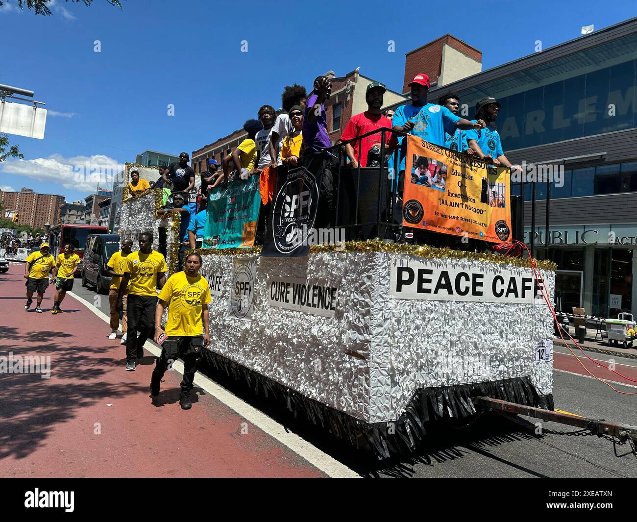 New York, N.Y. - June 15, 2024: Participants in the 31st annual Harlem Juneteenth Celebration Parade which is organized by Masjid Malcom Shabazz. Juneteenth is a federal holiday commerating the end of slavery in the United States on June 19, 1865, when Major General Gordon Granger ordered the final enforcement of the Emancipation Proclamation in Texas at the end of the American Civil War.   Float sponsored by Street Corner Resources (SCR), a non-profit founded by activist  Lesha Sekou born out of a concern over gun violence and gang activity amongst Harlem’s youth. Stock Photo