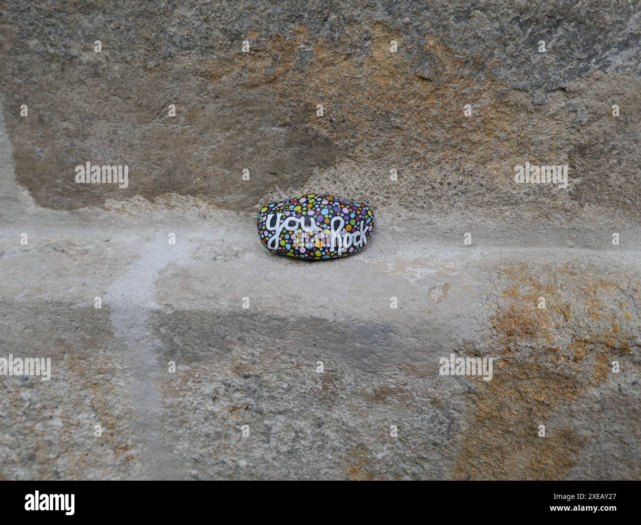 Kindness rock with you rock painted on concrete step Stock Photo - Alamy