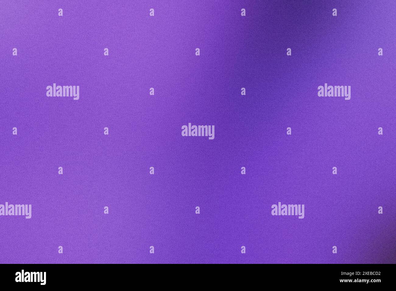 Abstract background featuring a vibrant purple hue with subtle grunge texture and a soft gradient Stock Photo