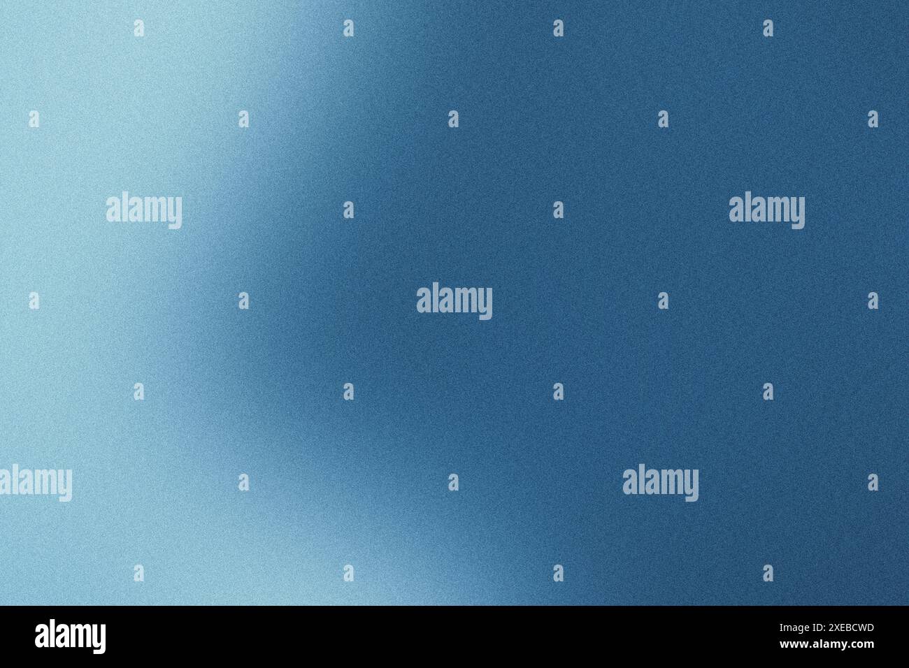 Gradient lighting on a blue textured background with a grainy finish Stock Photo