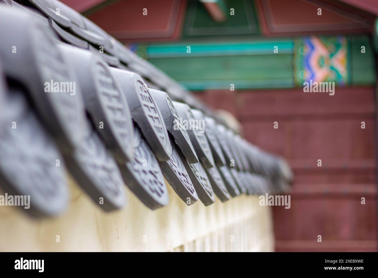 Traditional Korean wall with ancient patterns and symbols at Gyeongbokgung Palace in Seoul, South Korea, in selective focus. Stock Photo