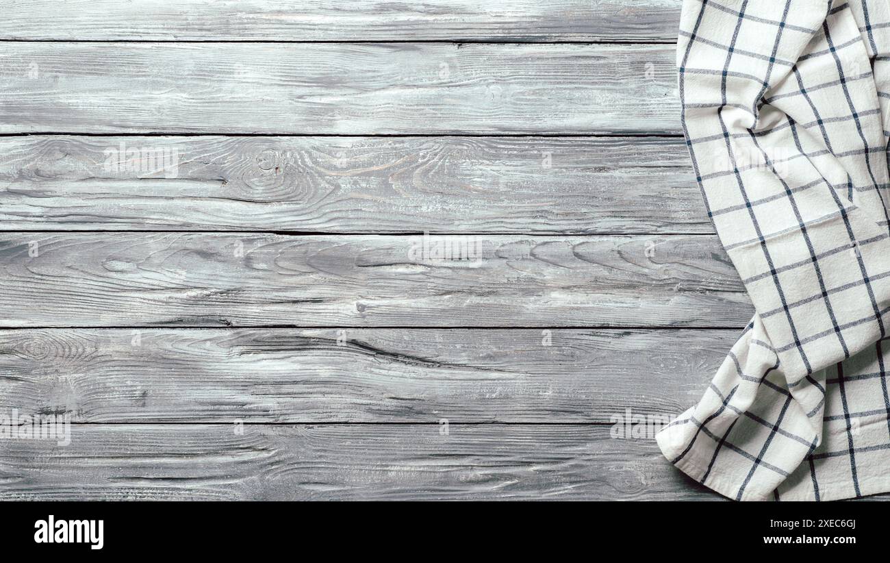 Gray wooden table with kitchen napkin, flat lay Stock Photo