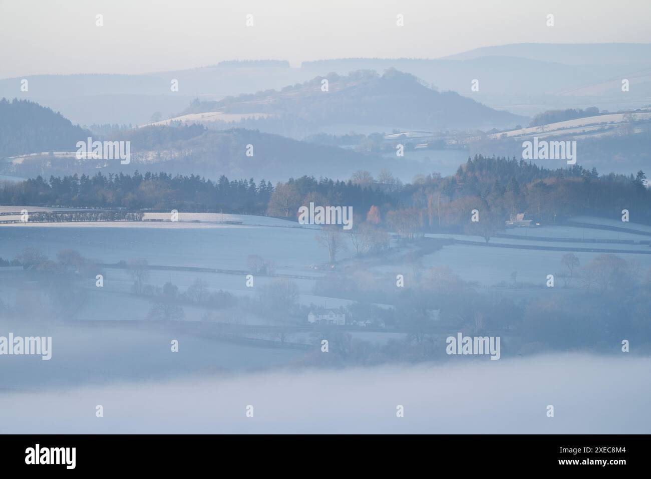 Dramatic and beautiful misty winter conditions viewed from the top of Ragleth Hill near Church Stretton, South Shropshire, England, UK Stock Photo