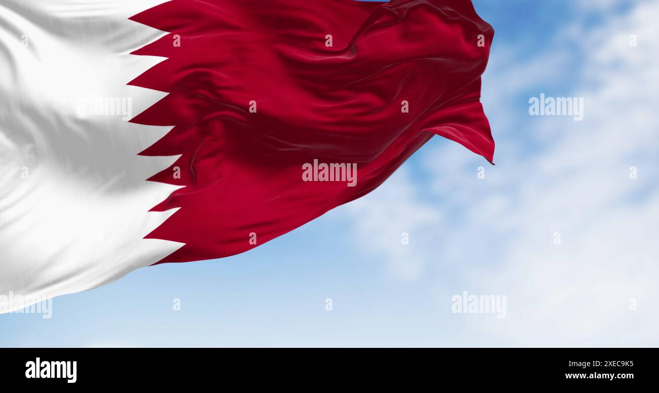 Detail of the Qatar national flag fluttering. The flag is maroon with a wide white wedge-shaped band. 3D illustration render. Cl Stock Photo