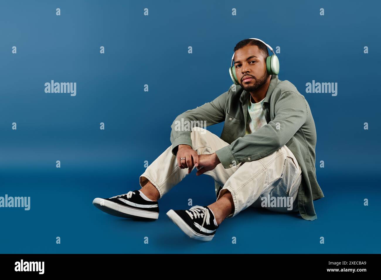 Man sitting on tan hi-res stock photography and images - Alamy