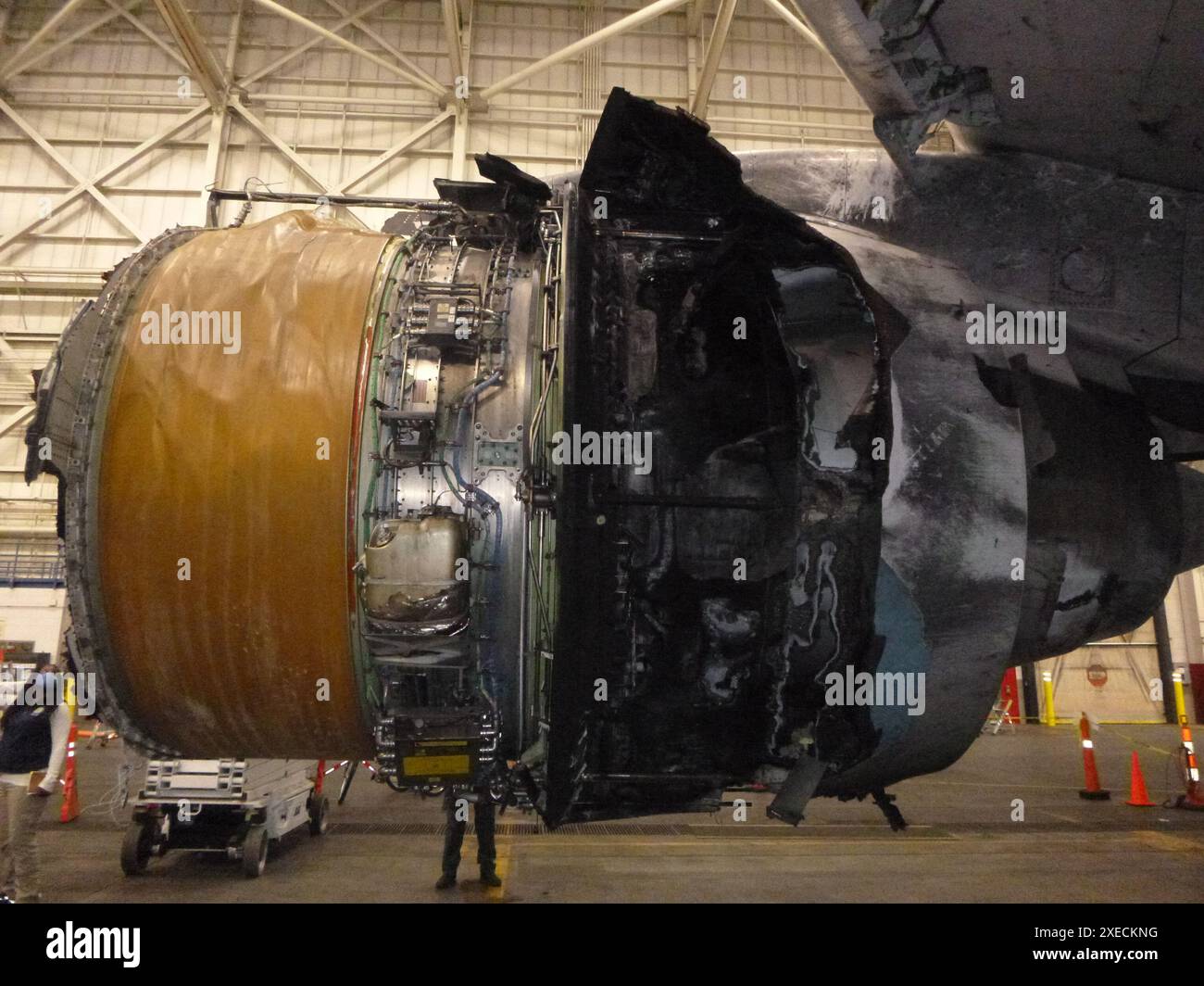 WASHINGTON (March 5, 2021) — In this photo taken Feb. 21, 2021, the fire damage to the inboard side of the right engine from the Feb. 20, 2021, United Airlines flight 328 engine failure event is seen. The engine is being examined in a hangar in Denver, as part of the NTSB’s ongoing investigation of the incident. The NTSB released an investigative update on its investigation of the incident March 5. UAL flight 328 experienced a failure of the right Pratt & Whitney PW4077 engine shortly after takeoff from Denver International Airport, Denver. There were no injuries reported, and the airplane sus Stock Photo