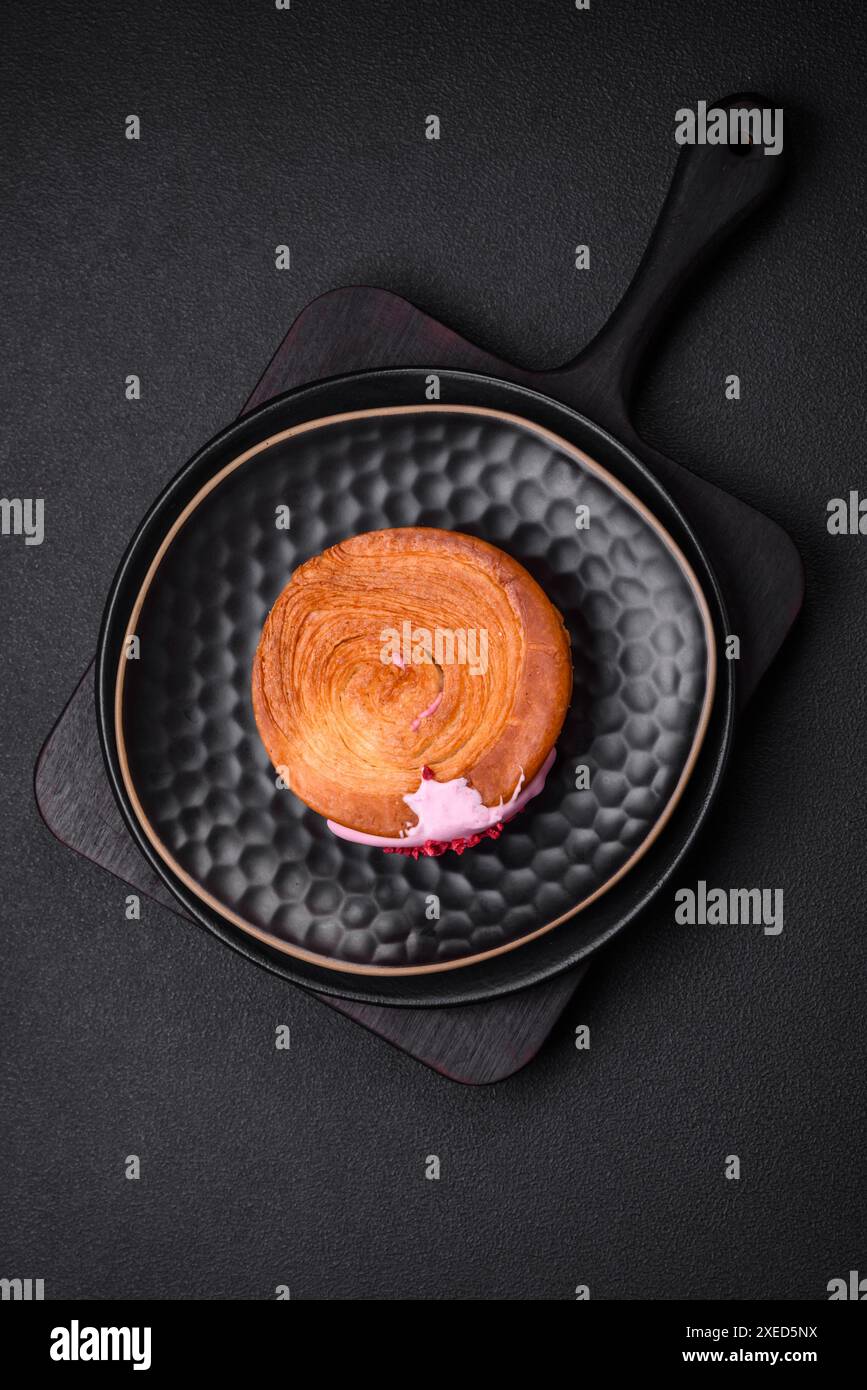 Round puff pastry croissant with raspberry filling or new york roll ...