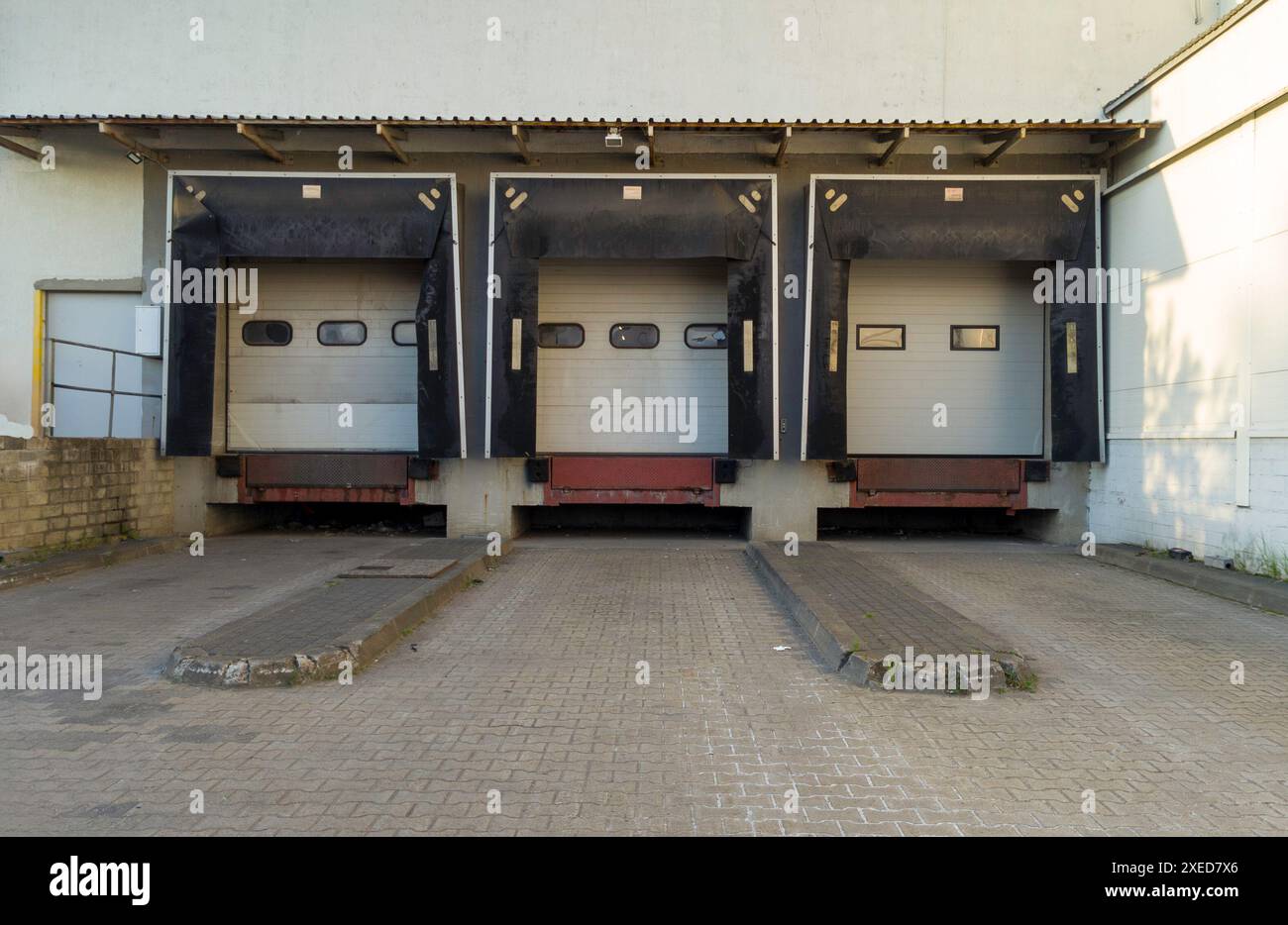 Three Industrial Loading Dock Doors Stock Photo - Alamy