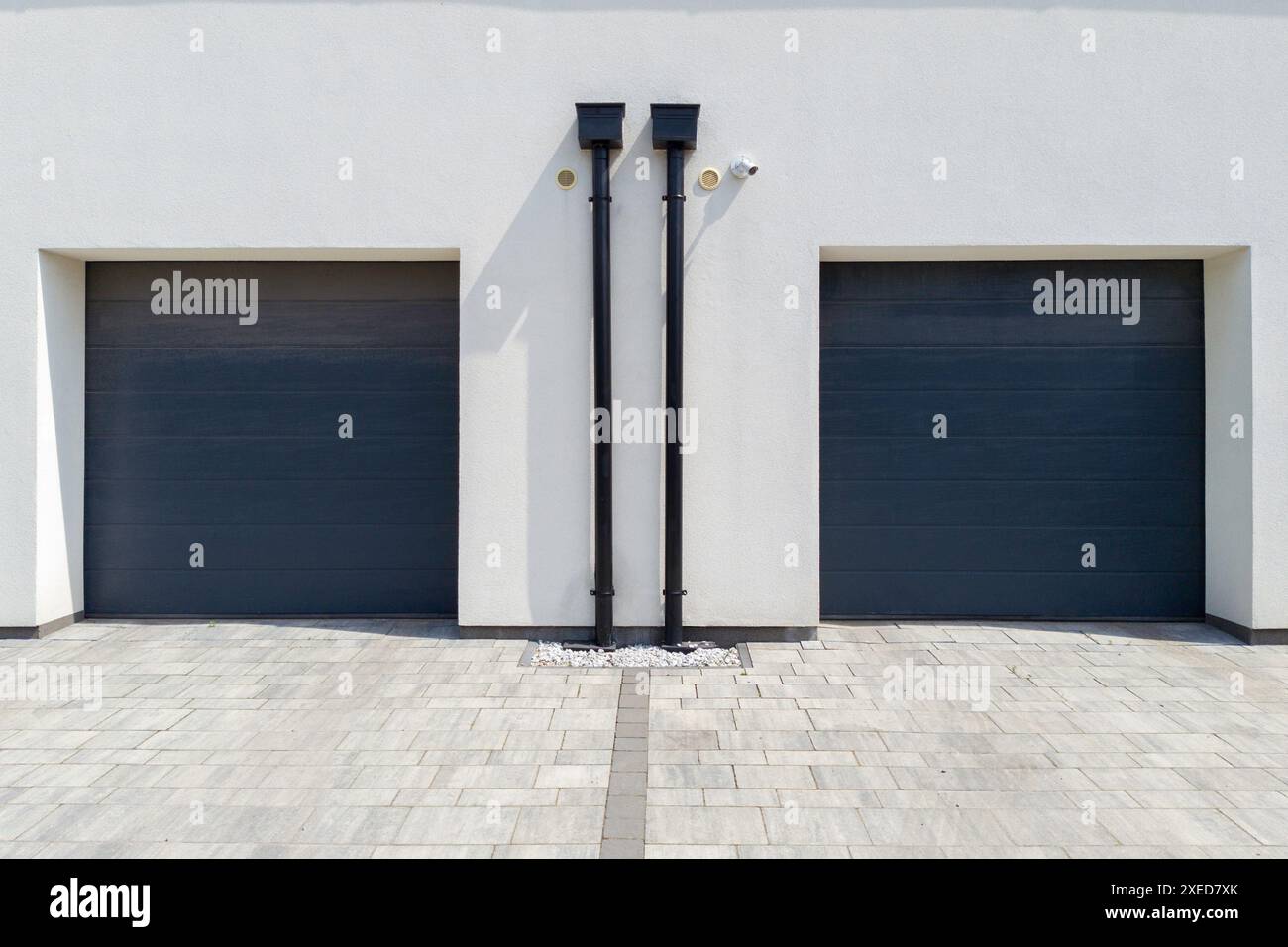 Two Modern Garage Doors on Building Stock Photo