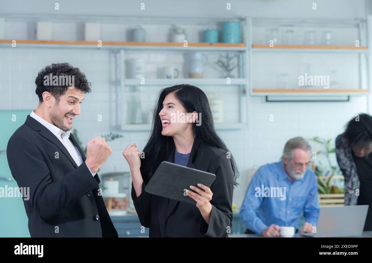 Portrait of group of small business owners, using their home as a workplace, talking and consulting with fun and smiles. Stock Photo