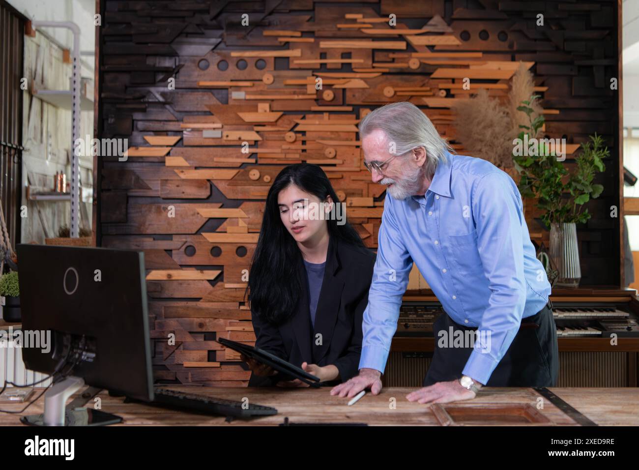 A businessmen and businesswomen working on computer in a modern office room Stock Photo