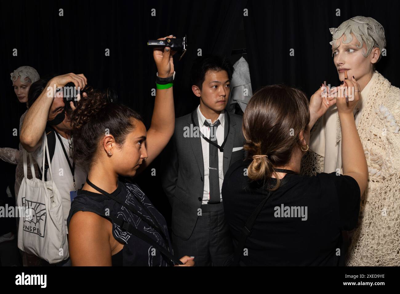 Models prepare backstage at the Thom Browne Haute Couture Fall-Winter ...