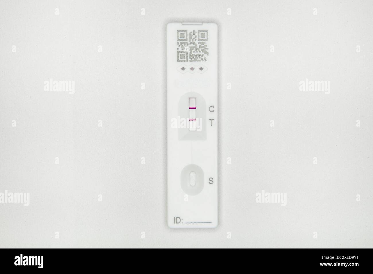 A home Covid test on a white studio background showing that it is a ...