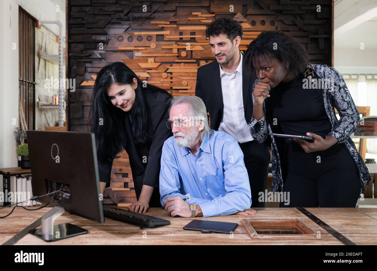 Simple meeting of small business owners, using their home as a workplace, talking and consulting with fun and smiles. Stock Photo