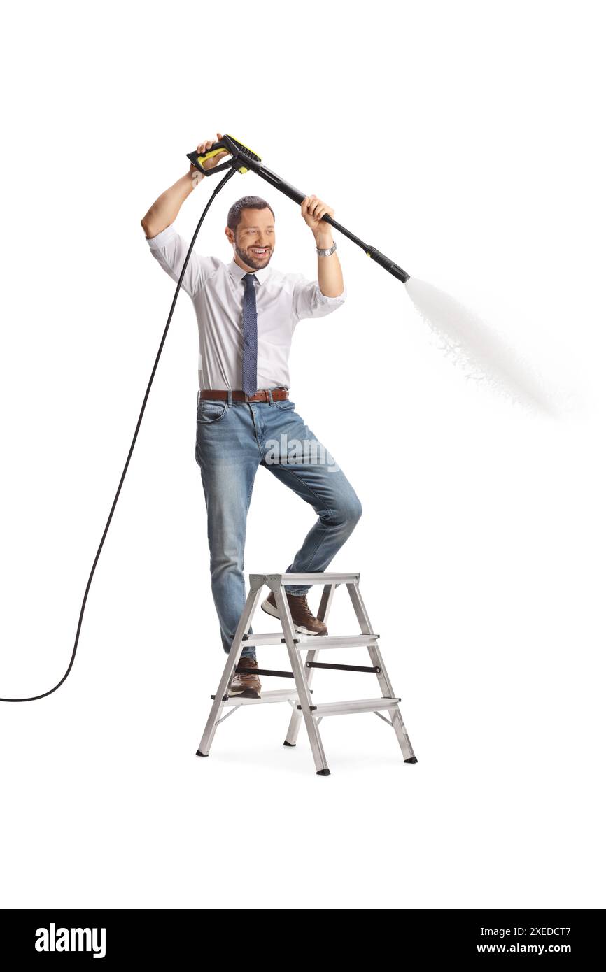 Man climbing a ladder and using a high pressure washer machine isolated on white background Stock Photo
