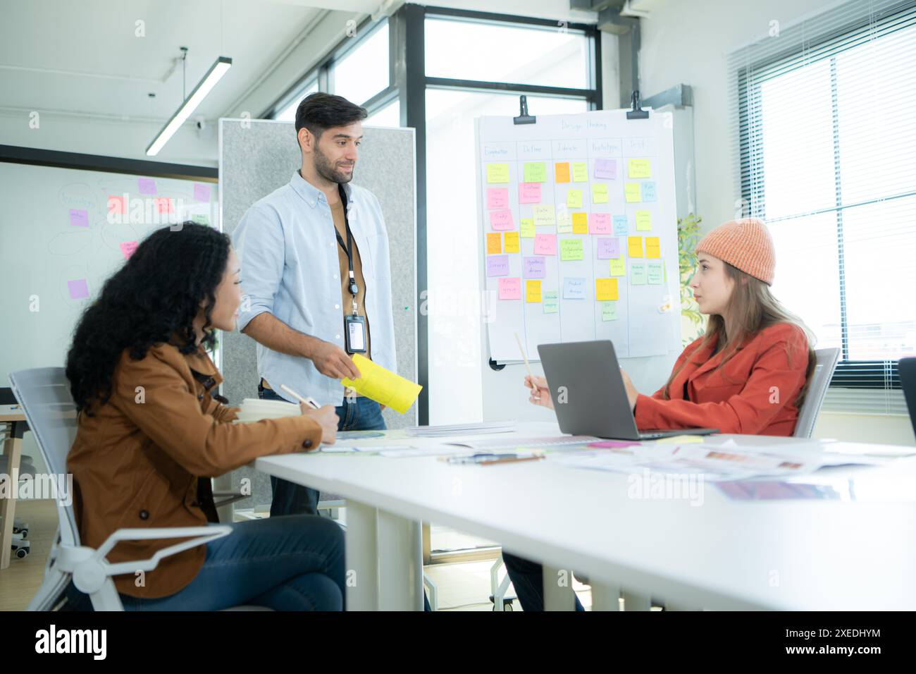 Multiethnic young business people working together in modern office ...